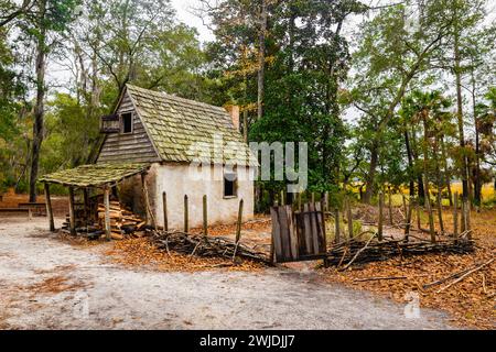 Exterior view of an old country house with bleachers and stone columns ...