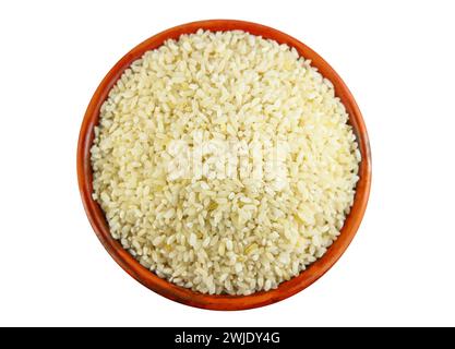 White rice in a clay bowl isolated on a white background Stock Photo