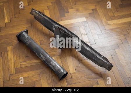 Torque tube components of an oldtimer vintage car, dismantled and ready to be sandblasted and powdercoated in satin black color. Stock Photo