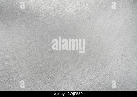 Monochrome texture of shiny scratched metal. Abstract background for design. Stock Photo