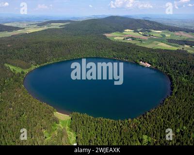 Haute-Loire department (south-central France): aerial view of the Bouchet Lake, a crater lake formed from an old volcano, and thus roughly circular, l Stock Photo