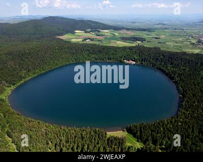 Haute-Loire department (south-central France): aerial view of the Bouchet Lake, a crater lake formed from an old volcano, and thus roughly circular, l Stock Photo