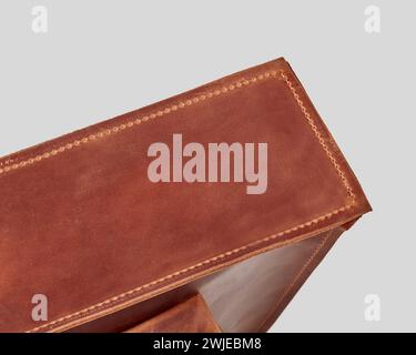 Detail view of bottom of brown leather handcrafted bag Stock Photo