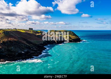 View over Gullastem bay and Tintagel Island from Willapark, Tintagel, Cornwall, UK Stock Photo