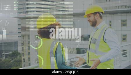 Two architects on a rooftop with cityscape and data graphics Stock Photo