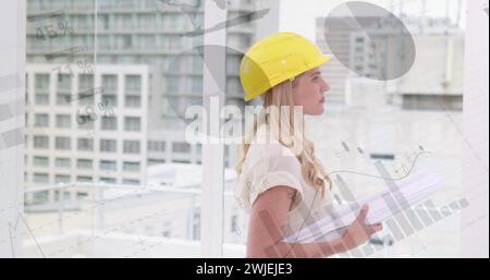 Architect with plans and foreground graphs Stock Photo