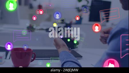 Image of media icons over hands using smartphone Stock Photo