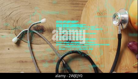 Image of data processing over stethoscope and fruit Stock Photo