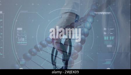 Image of dna strand and scope scanning over hand holding stethoscope Stock Photo