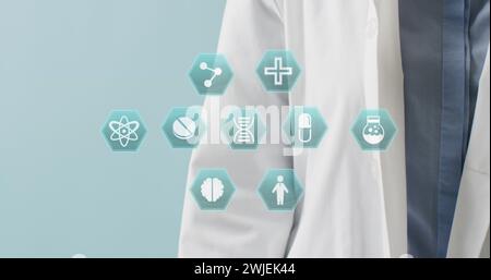 Image of medical icons over caucasian female doctor with stethoscope Stock Photo