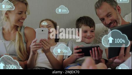 Digital image shows family using tech with growing cloud network concept. Stock Photo