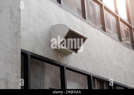 office building air ventilator pipe hole ventilates hot air from inside building to outside. Stock Photo