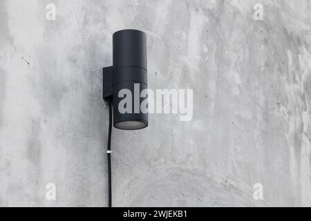 outdoor lighting lamp downlight wall mount modern design for office building on cement exterior Stock Photo