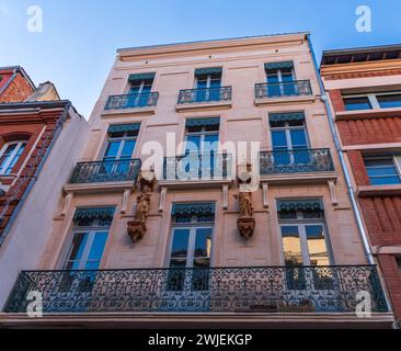 Facades of houses in Toulouse in Occitanie, France Stock Photo