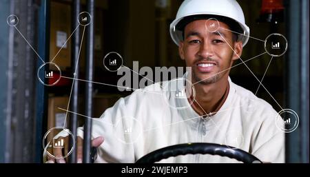 Image of network of conncetions with icons over biracial male worker in warehouse Stock Photo