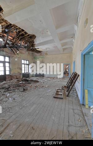 354 Old classroom remains of a ruined, abandoned former primary school full of rubble. Vevchani-North Macedonia. Stock Photo