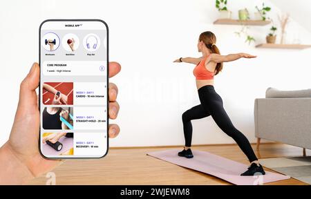 Home workout and yoga with sports mobile application. Fitness mobile app interface on display of phone on background of woman doing yoga at home. Stock Photo