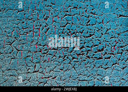Blurred texture of blue peeling paint on a rusty metal surface. Stock Photo