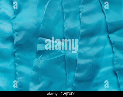 Texture of blue structural fabrics stacked on top of each other. Stock Photo