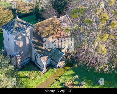 aerial view of the tiny st catherine of siena church in cocking west sussex, parts of which date from the 11th century Stock Photo