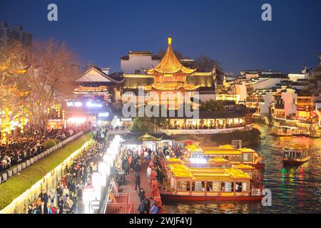 Beijing, China's Jiangsu Province. 14th Feb, 2024. Tourists visit the Fuzi (Confucius) Temple scenic area in Nanjing, east China's Jiangsu Province, Feb. 14, 2024. More Chinese people nowadays choose to go on a journey during the Spring Festival to experience different cultures and lunar new year atmosphere. Credit: Su Yang/Xinhua/Alamy Live News Stock Photo