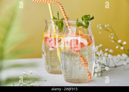 Aesthetic fresh drink with citrus. Low alcohol, zero proof beverages, detox vitaminized water. Stock Photo