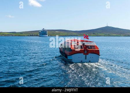 Viking Venus cruise ship from Bergen at anchor in Lerwick Harbour Shetland being attended by tenders Stock Photo