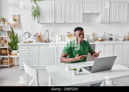 happy deaf african american freelancer using sign language for communication during video call Stock Photo