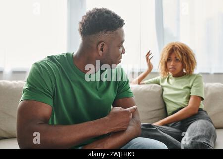 serious conversation between african american couple, misunderstanding and disagreement concept Stock Photo