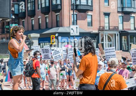 Boston, MA, US-June 25, 2022:  Protests holding pro-abortion signs at demonstration in response to the Supreme Court ruling overturning Roe v. Wade. Stock Photo