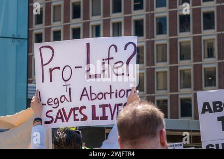 Boston, MA, US-June 25, 2022:  Protests holding pro-abortion signs at demonstration in response to the Supreme Court ruling overturning Roe v. Wade. Stock Photo