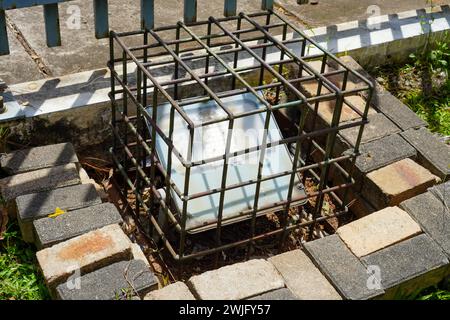 Safety iron cage for garden spotlights. Sleek protection Stock Photo