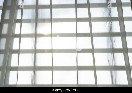 White fabric curtains that block sunlight Stock Photo