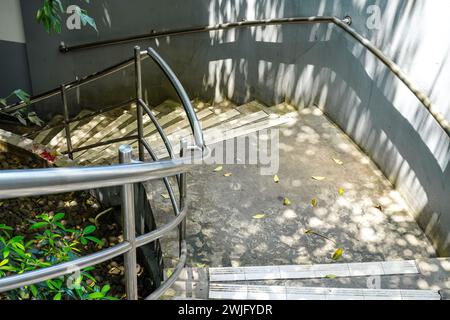 Looking down the concrete stairs in the garden Stock Photo
