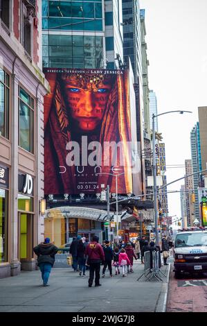 Hordes of people cross West 42nd Street under advertising for the Warner Bros. PicturesÕ  ÒDune: Part TwoÓ film in Times Square in New York on Sunday, February 11, 2024. The film is slated to be released March 1. (© Richard B. Levine) Stock Photo