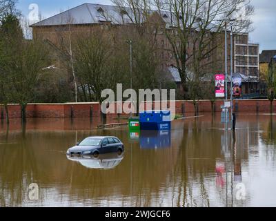 River Ouse burst banks after heavy rain (high deep flood water, St George's Field riverside parking area flooded) - York, North Yorkshire, England UK. Stock Photo