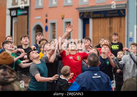 Youths take part in the annual 'Hand ba' is played in Scottish borders town Jedburgh. Traditionally the first ever game was played with an Englishman’s head,  the ribbons on the ball symbolise his hair. The teams (Uppies and Doonies) are chosen by where they live – Uppies are those born to the South and Doonies to the North of the Market Cross.  Credit: Euan Cherry Stock Photo