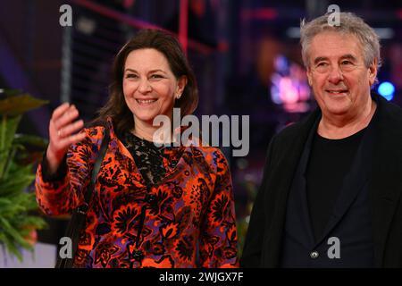 Berlin, Germany. 15th Feb, 2024. Actress Martina Gedeck and her husband, director Markus Imboden, walk the red carpet on the opening night of the Berlinale. The film 'Small Things Like These' will be shown. The 74th Berlin International Film Festival will take place from February 15 - 25, 2024. Credit: Jens Kalaene/dpa/Alamy Live News Stock Photo