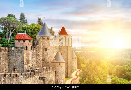 French fortified medieval city of Carcassonne in France at sunset - Cité de Carcassone Stock Photo