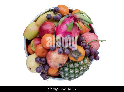 Variety of Fresh assorted fruits include Pineapple, Dragon fruit, Orange, Bananas, Black seedless grapes, Persimmon, pomegranate, apple and pear on Ro Stock Photo