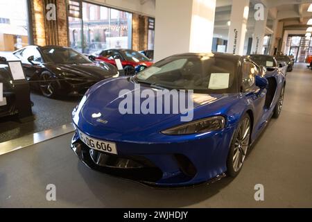 super-fast blue German McLaren GT Sports car, twin-turbocharged V8 engine vehicle in exhibition hall, British manufacturer, Automotive History, Frankf Stock Photo