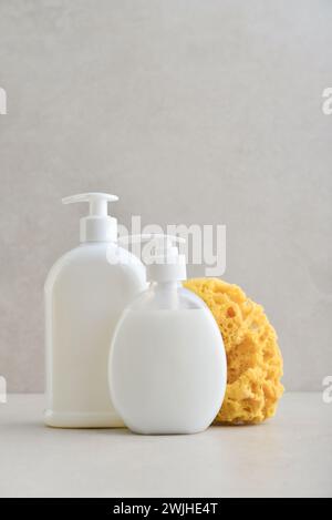 Two white unbranded dispenser bottle on light background, cosmetic packaging mockup with copy space Stock Photo