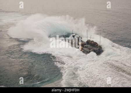 Pacific Ocean. 17th Jan, 2024. A U.S. Marine Corps amphibious combat vehicle (ACV), assigned to Battalion Landing Team (BLT) 1/5, 15th Marine Expeditionary Unit (MEU), launches from the well deck of the amphibious dock landing ship USS Harpers Ferry (LSD 4), while underway in the Pacific Ocean, January. 17, 2024. The Boxer Amphibious Ready Group, comprised of USS Boxer (LHD 4), USS Somerset (LPD 25), and Harpers Ferry, and the embarked 15th MEU are underway conducting integrated training and routine operations in U.S. 3rd Fleet. (Credit Image: © U.S. Navy/ZUMA Press Wire) EDITORIAL USAGE O Stock Photo