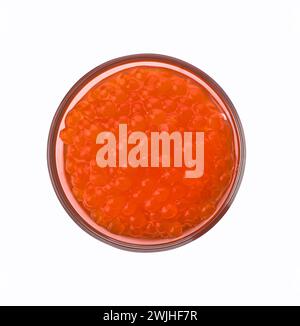 Glass of red trout caviar isolated on a white background, top view Stock Photo