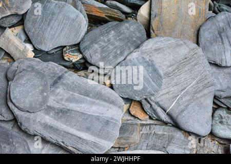 Natural slate rocks found on the beach in Cornwall, UK Stock Photo