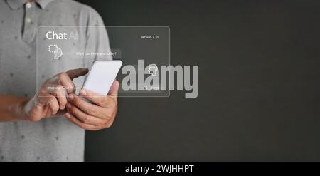 Chat ai concept. A man chats with AI on a smartphone. Chatting with a smart artificial intelligence, a customer chatbot service application, using com Stock Photo