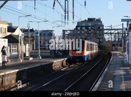 Overground train to Chingford leaving Bethnal Green station on the rebranded Weaver Line in London, UK Stock Photo