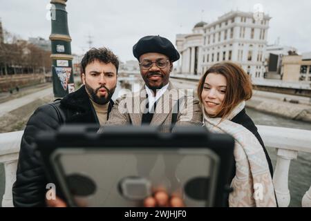 Young entrepreneurs taking selfie in city, professional friends enjoying urban life. Stock Photo