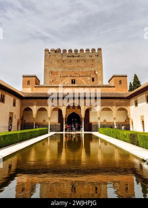 Myrtle courtyard with water basin and Torre de Comares, arabesque Moorish architecture, Nasrid palaces, Alhambra, Granada, Andalusia, Spain Stock Photo