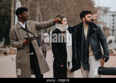 Young entrepreneurs discussing over tablet at outdoor urban setting. Stock Photo